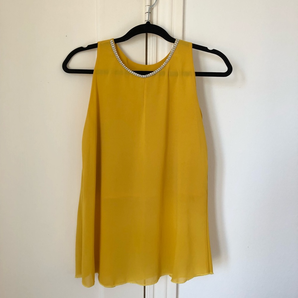 Yellow top with a sparkly neckline